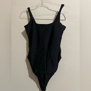 Plain black tank bathing suit